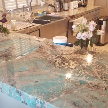 Dakota Benjamin - a kitchen with a marble countertop - General Contractors Near Me Dakota Benjamin - a kitchen with a marble countertop - General Contractors Near Me