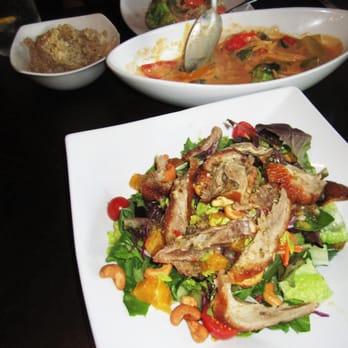 Thai Talay - Duck Confit Salad posing in the front. California Vegan Curry being enjoyed in the background. - Thai Near Me - Westchester, California Thai Talay - Duck Confit Salad posing in the front. California Vegan Curry being enjoyed in the background. - Thai Near Me - Westchester, California