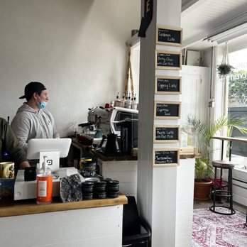 Tolima Coffee - a man working at a coffee shop - Coffee & Tea Near Me - Tustin, California Tolima Coffee - a man working at a coffee shop - Coffee & Tea Near Me - Tustin, California