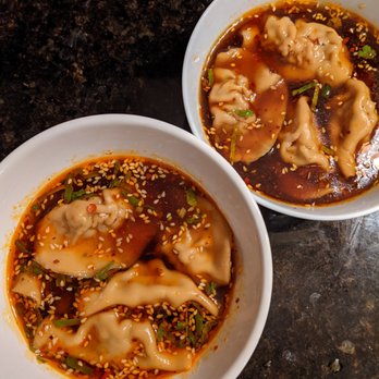 Lao Peng You - Pork and Chive Dumplings // In broth with dried shrimp, zha cai, sesame seeds, soy, mushroom, garlic, green onion, cilantro, chili oil - Chinese Near Me - Chicago, Illinois