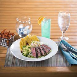 Harry's Poolside Bar & Grill - Chimichurri Steak and Avocado Salad with avocado, queso fresco, onion, cilantro, and avocado lime vinaigrette
