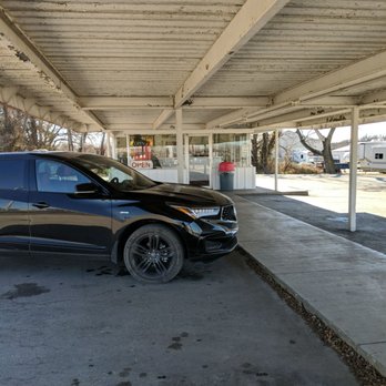 Simone's Drive-In - a car parked under a covered parking lot - Burgers Near Me - El Dorado Springs, Missouri Simone's Drive-In - a car parked under a covered parking lot - Burgers Near Me - El Dorado Springs, Missouri