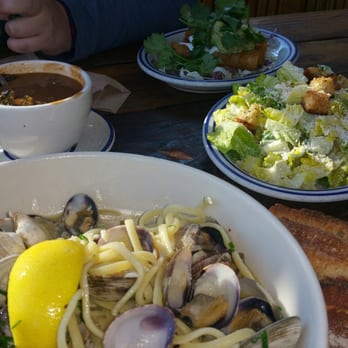 Fish - Here we have featured the shrimp bisque, albacore taquitos in the back, Caesar salad, and my pasta with clams. - Seafood Near Me - Sausalito, California