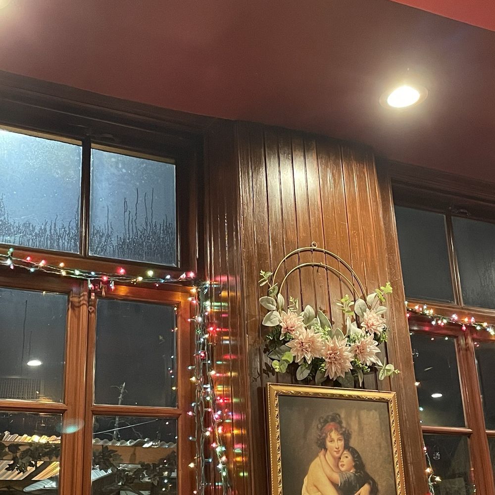 Radicchio Cafe - a painting of a woman holding a child - Italian Near Me - Philadelphia, Pennsylvania Radicchio Cafe - a painting of a woman holding a child - Italian Near Me - Philadelphia, Pennsylvania