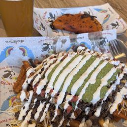 Carne Asada fries and birria taco Carne Asada fries and birria taco