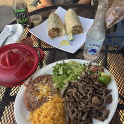 Carne asada plate and carnitas burrito