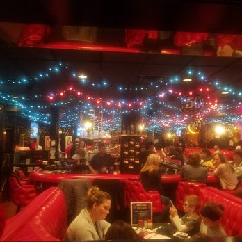 Leonardo's - The main dining room as viewed from the back room.  That bar is just too cool. - Pizza Near Me - Cedar Rapids, Iowa