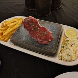 The Tomo Bar & Eatery - NZ sirloin steak (or lamb or salmon) grills at your table on a hot stone, so you can determine the sear and level of doneness