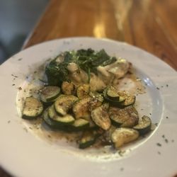16 East - Signature smothered chicken with zucchini