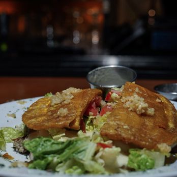 Latin Kitchen - a plate of food on a table - Latin American Near Me - Bronx, New York Latin Kitchen - a plate of food on a table - Latin American Near Me - Bronx, New York