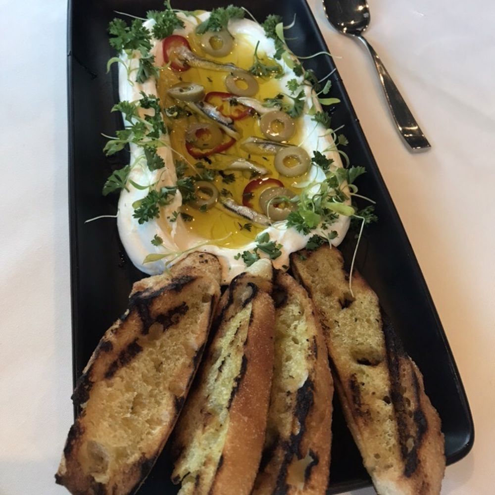 Boquerones- white anchovies, olives, chili and goat cheese Boquerones- white anchovies, olives, chili and goat cheese