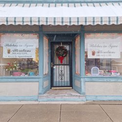 Stitches in Tyme Alterations - Front of shop with updated awning and signs.
