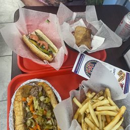 Italian beef with hot giardinera, fries, chicago dog, & pizza puff Italian beef with hot giardinera, fries, chicago dog, & pizza puff