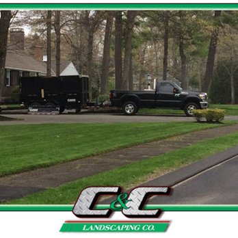C&C Landscaping - a truck and trailer parked on the side of the road - Landscaping Near Me - Peabody, Massachusetts