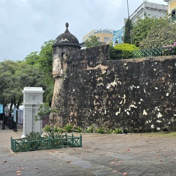 Paseo de la Princesa - Walking up Paseo de la Princesa while vendors are setting up on a rainy Saturday morning - Local Flavor Near Me - San Juan, Puerto Rico