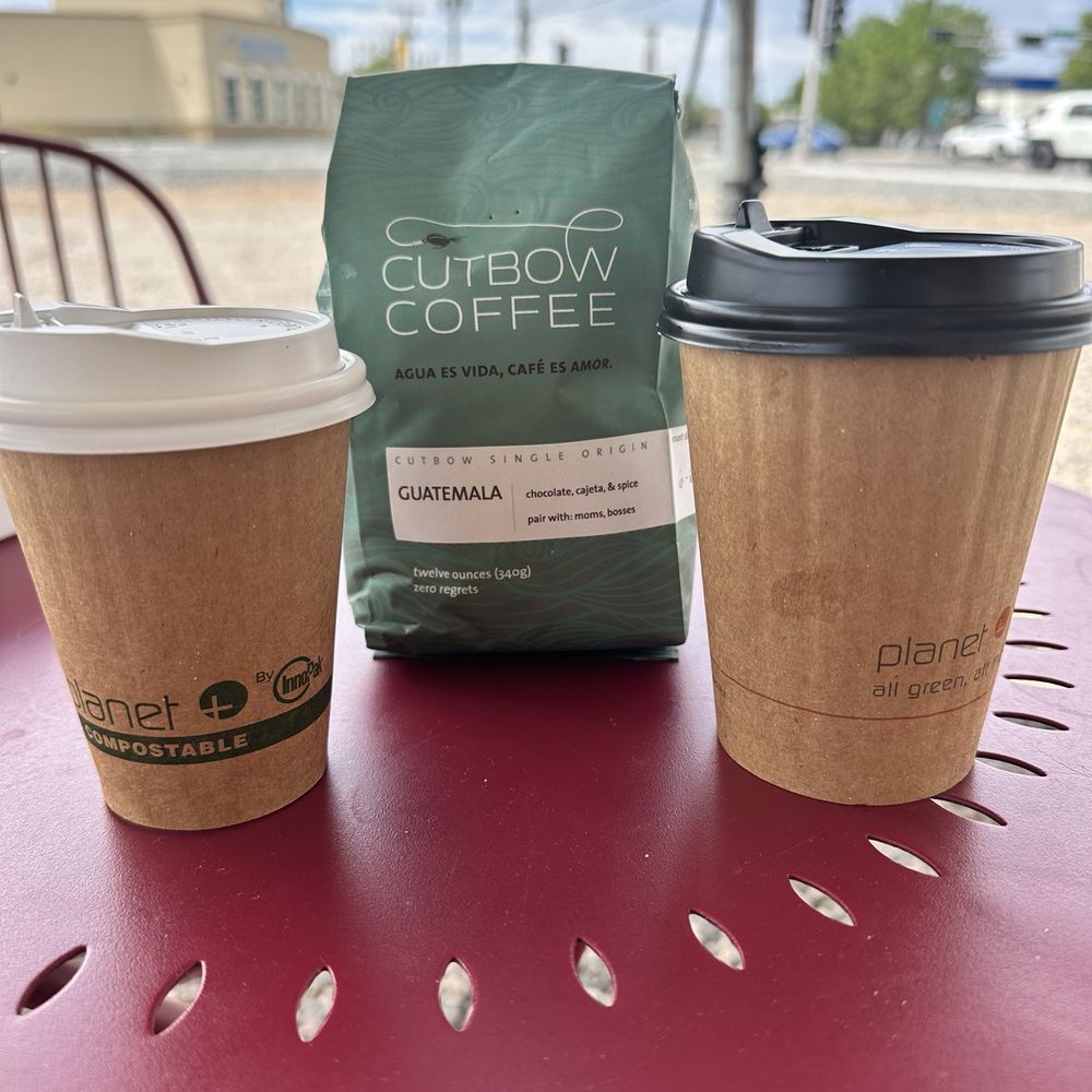 Cutbow Coffee Roastology - Sitting outside with my Cortado, bag of Guatemala coffee and a cup of Guatemala drip! - Coffee Roasteries Near Me - Albuquerque, New Mexico