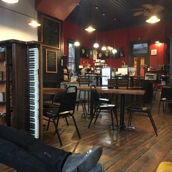 The Beanhive - a man laying on a bench in a coffee shop - Coffee & Tea Near Me - Galesburg, Illinois