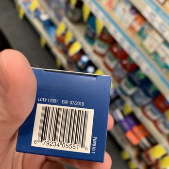 CVS Pharmacy - a hand holding a blue box with a barcode on it - Drugstores Near Me - INDIANAPOLIS, Indiana