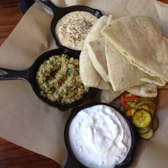 Area Four - trio of dips! hummus, olive tapanade, tzatziki with delightful pickles and homemade pita - Pizza Near Me - Cambridge, Massachusetts