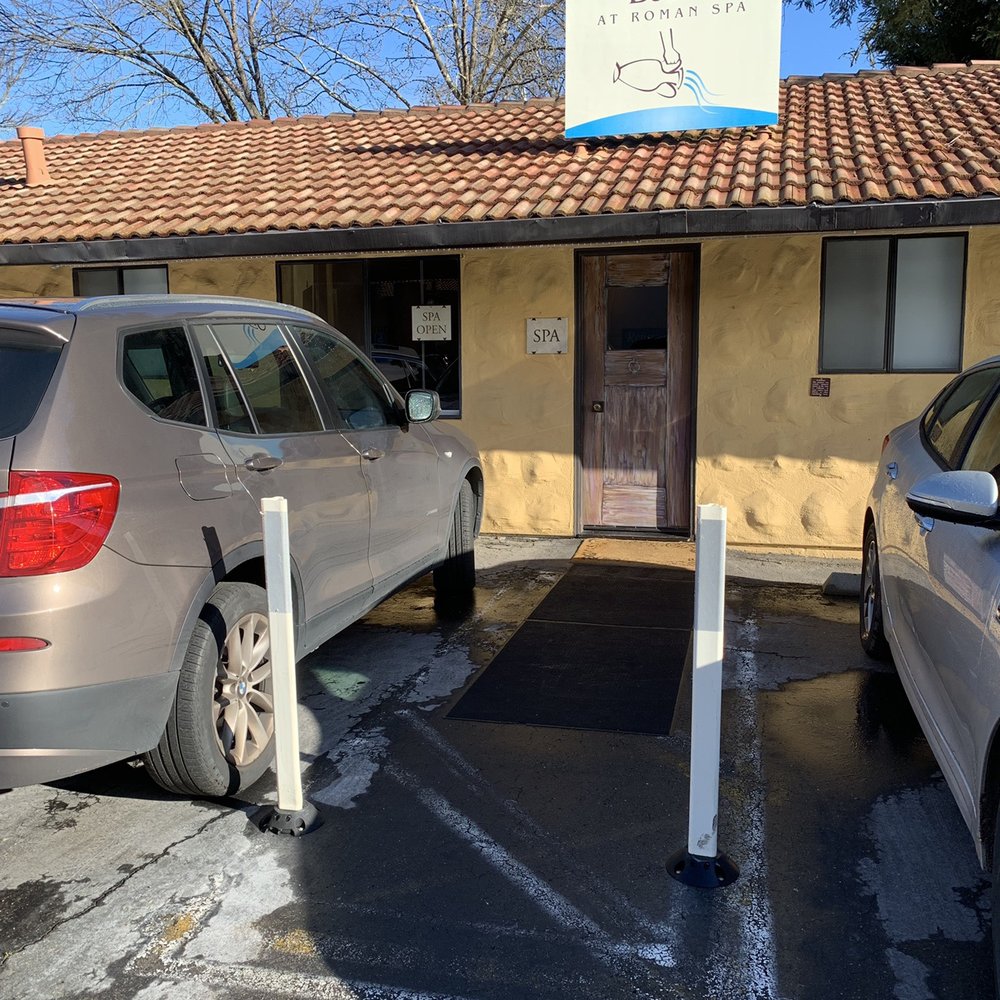 The Baths entrance is behind the hotel entrance. Different driveway. Less attractive curb appeal. The Baths entrance is behind the hotel entrance. Different driveway. Less attractive curb appeal.