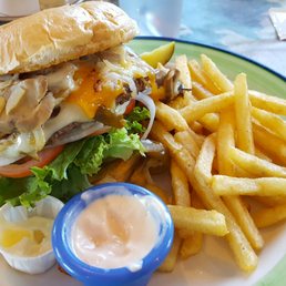 The "duke" burger with a side of fries and garlic sauce.