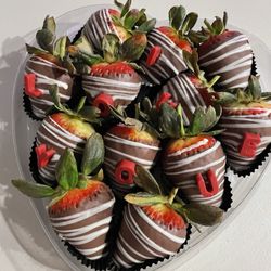 Rocky Mountain Chocolate Factory - Chocolate covered strawberries with "I love you" letters on top.