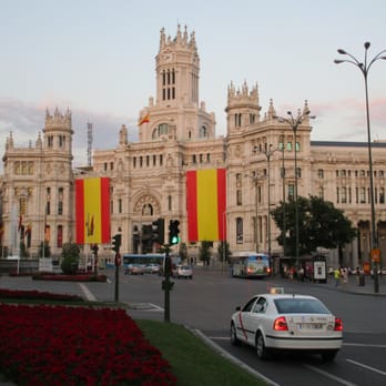 Palacio de Cibeles - Cibeles Palace at Dusk (Spanish flags hung for coronation of Felipe VI) - Landmarks & Historical Buildings Near Me - Madrid, M