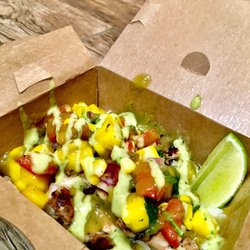 The Fat Cactus Food Truck - Fully loaded chicken jasmine rice bowl with mango salsa and and jalapeño ranch sauce served with a fresh sliced lime