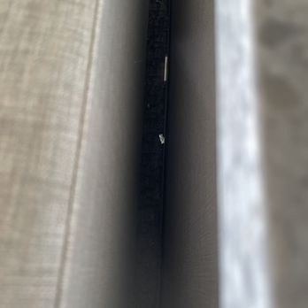 Hallmark Resort - Visible trash left between the sofa and pony wall. - Resorts Near Me - Newport, Oregon Hallmark Resort - Visible trash left between the sofa and pony wall. - Resorts Near Me - Newport, Oregon