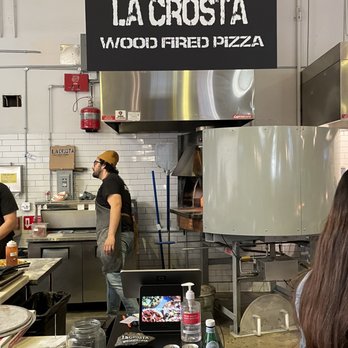 La Crosta Wood Fired Pizza - Friendly staff by the sign and the pizza oven. He immediately posed after, but I respect staff privacy so going with this one. - Pizza Near Me - Whittier, California