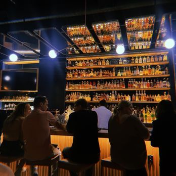 Bridges & Bourbon - Beautiful bar area, every detail is so gorgeous! Mirrors and lighting above, the bar itself, the barstools! In love with it all. - New American Near Me - Pittsburgh, Pennsylvania