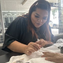 Clara, doing the manicure and pedicure.