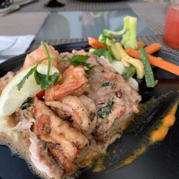 Shrimp and Mahi Mahi Paul this dish was very very delicious ! Large  portions.