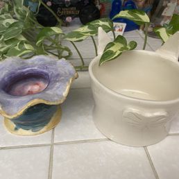 One cat pot and one French inspired vase. One cat pot and one French inspired vase.