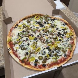 Vegetable pizza with added jalapeños and bell peppers