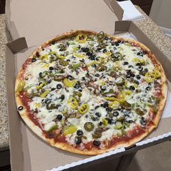 Vegetable pizza with added jalapeños and bell peppers