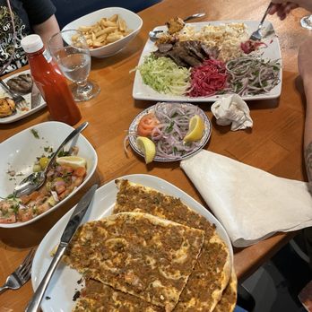 Turkish Kitchen - Coban salata, mix grill (partially eaten), and lahmacun - Mediterranean Near Me - Brandon, Florida Turkish Kitchen - Coban salata, mix grill (partially eaten), and lahmacun - Mediterranean Near Me - Brandon, Florida
