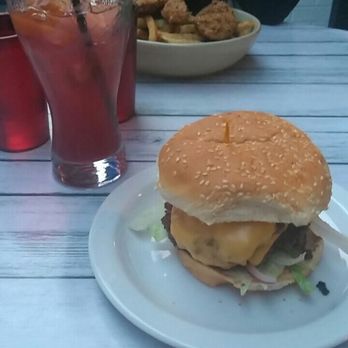 The King Eddy - King Eddy burger with Sangria and chicken tenders with fries in the background - Burgers Near Me - Ottawa, Ontario