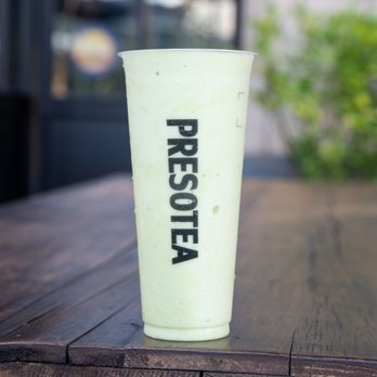 Presotea Lawrence - a green smoothie on a wooden table - Bubble Tea Near Me - Lawrence, Kansas Presotea Lawrence - a green smoothie on a wooden table - Bubble Tea Near Me - Lawrence, Kansas