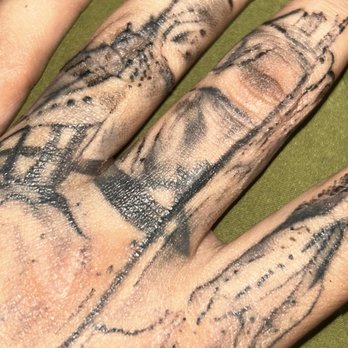 Krybaby’s Tattoo Studio - The original tattoo on the middle finger showing through. He did not pack the ink properly - Tattoo Near Me - Warr Acres, Oklahoma Krybaby’s Tattoo Studio - The original tattoo on the middle finger showing through. He did not pack the ink properly - Tattoo Near Me - Warr Acres, Oklahoma