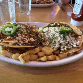 AR's Breakfast & Brunch - Divorced eggs over medium with yummy red and green sauce. Over your typical fried potatoes. - Breakfast & Brunch Near Me - Overland Park, Kansas