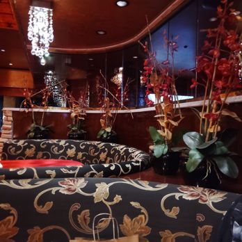 Chi - I think those were real orchid plants decorating our dining booth! (I could be wrong) - Chinese Near Me - Reno, Nevada