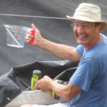 Uncle Tilo's Clean Water - a man holding a can of water - Water Purification Services Near Me Uncle Tilo's Clean Water - a man holding a can of water - Water Purification Services Near Me