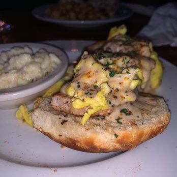 The Smiling Dog - "Biscuit&Chops" - with scrambled eggs and grits - Pubs Near Me - Baton Rouge, Louisiana The Smiling Dog - "Biscuit&Chops" - with scrambled eggs and grits - Pubs Near Me - Baton Rouge, Louisiana
