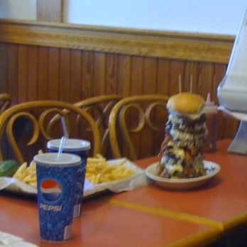 Eagle's Deli - The Eagle's Challenge Burger! 5lbs of beef, 20 slices of cheese, 20 slices of bacon, 5 lbs of fries, and a giant pickle. - Delis Near Me - Brighton, Massachusetts Eagle's Deli - The Eagle's Challenge Burger! 5lbs of beef, 20 slices of cheese, 20 slices of bacon, 5 lbs of fries, and a giant pickle. - Delis Near Me - Brighton, Massachusetts