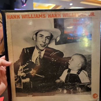 Pizza Rock - Got the Hank Williams Menu. Maybe Jr. Sitting next to him. Album cover - Pizza Near Me - Henderson, Nevada Pizza Rock - Got the Hank Williams Menu. Maybe Jr. Sitting next to him. Album cover - Pizza Near Me - Henderson, Nevada