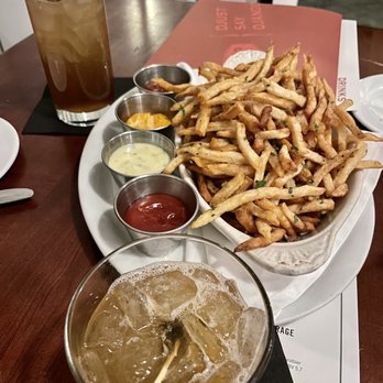 Django - Duck Frites with a Long Island iced Tea and an amaretto sour - French Near Me - Des Moines, Iowa Django - Duck Frites with a Long Island iced Tea and an amaretto sour - French Near Me - Des Moines, Iowa