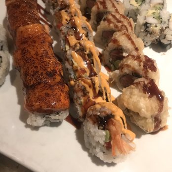 Mon Jin Lau - Salmon on the Beach, Spicy Shrimp Tempura Roll, Great Wall. To the sides are Cali rolls that were a mistake. - Asian Fusion Near Me - Troy, Michigan Mon Jin Lau - Salmon on the Beach, Spicy Shrimp Tempura Roll, Great Wall. To the sides are Cali rolls that were a mistake. - Asian Fusion Near Me - Troy, Michigan