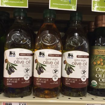 Food Lion - 9/3/2016 shows yellow oil in-between two bottles of Extra Virgin Olive Oil - Grocery Near Me - Durham, North Carolina Food Lion - 9/3/2016 shows yellow oil in-between two bottles of Extra Virgin Olive Oil - Grocery Near Me - Durham, North Carolina