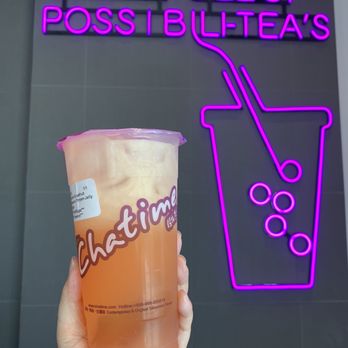 Chatime - a hand holding a drink in front of a neon sign - Bubble Tea Near Me - Oakville, Ontario Chatime - a hand holding a drink in front of a neon sign - Bubble Tea Near Me - Oakville, Ontario